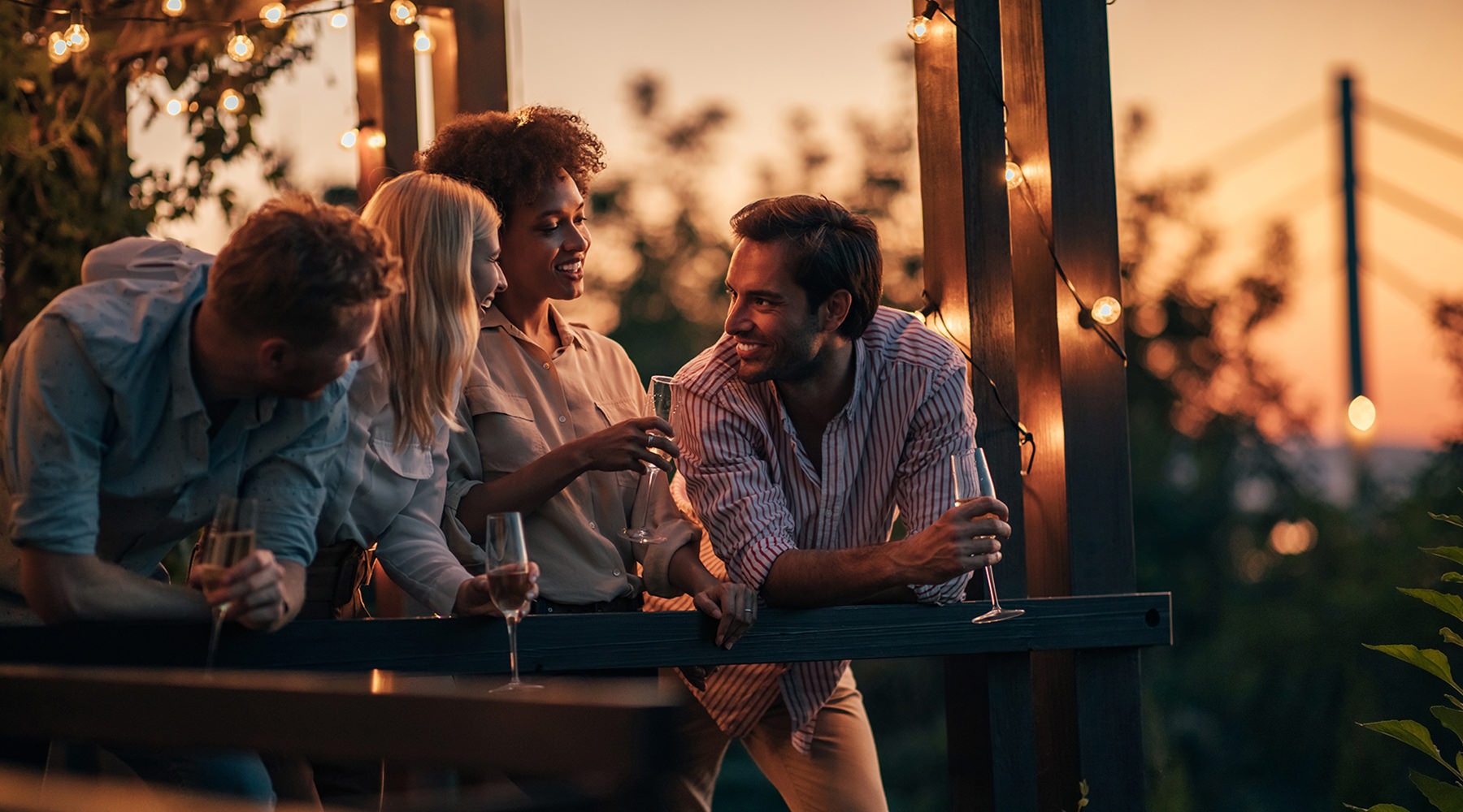 Settle Into Comfort at Apex Apopka friends laughing on a balcony